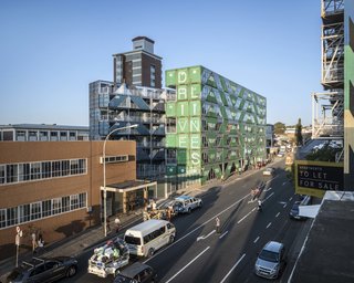 The building's industrial character ties in nicely with the surrounding infrastructure and architecture.