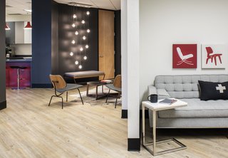 An open floor plan creates a seamless connection between various spaces. Bold colors carry from space to space with special accents like the Nest Pillow.