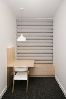 Phone booths provide private spaces for phone calls or focus work.