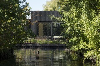 Set on an elongated island, the holiday home embraces the waterfront setting. 