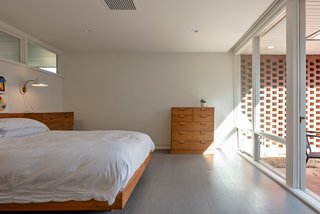 In the master bedroom, Durell's custom-designed bed and dresser remain.