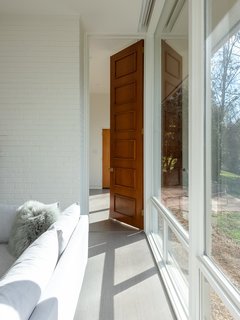 Large overhangs block the harsh summer sun while allowing the low winter sun to infiltrate the living spaces.