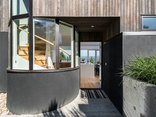 The home's unique spiral staircase can be seen through the home's exterior.