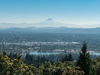 The hillside home enjoys picturesque views of the Cascade Mountains.