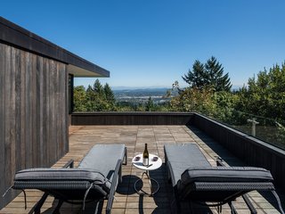 The upper deck, surrounded by a glass rail, is an ideal spot to enjoy panoramic Portland views.