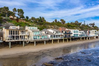 Located in a coveted, beachfront, gated community, this Malibu home is surrounded by ocean views and miles of walking trails. 