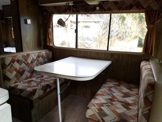 A Portland Couple Renovate a 1982 RV, Turning It Into Their New Home - Photo 6 of 12 - The Winnebago's original dinette area before they renovated it.