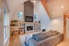 Modern home with Living Room, Sofa, Sectional, Standard Layout Fireplace, Medium Hardwood Floor, Ceiling Lighting, and Gas Burning Fireplace. Den Photo 9 of Bayview Road
