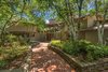 Modern home with Outdoor, Trees, Walkways, Shrubs, Front Yard, and Gardens. Front Photo 2 of Beautifully Designed Contemporary