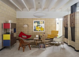 Primary colors and bold art dominate the home's decor. "The yellow and green Warhol flowers—that's my favorite Warhol. My last name means flowers in Italian. So I just l love flowers," says Florentino.