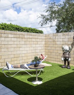 Florentino is discovering an appreciation of the outdoors in his new home, while enjoying the company of his life-sized, Toy Tokyo reproduction KAWS sculpture his grandmother found for him. (The real ones live inside). 