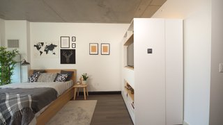 The Pocket Closet takes up the space of two wardrobes, yet it can serve as a walk-in closet, desk, entertainment center, or dining bar. 