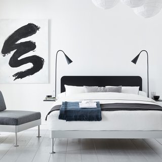A black headboard and two matching side tables can be easily removed from the Delaktig bed frame to create a whole new look in minutes.