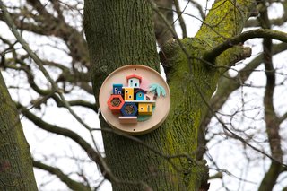 Honey I’m Home! by Hattie Newman is a Brazilian-style bee village created from an old IKEA BURVIK side table. 