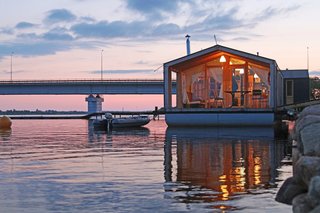 A New Book For Those Who Dream of Living in a Floating Home - Photo 4 of 11 - Architect Ivan Ovchinnikov’s modular home company DublDom is making turn-key houseboats ubiquitous and easily accessible by constructing and installing the dwellings quickly. The timber-frame homes are currently being manufactured in Russia and the Czech Republic. Ovchinnikov is looking to bring his company stateside in the future. 