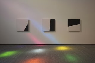 A series of black-and-white abstract panels symbolize the Stations of the Cross.