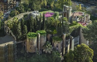 A lush espalier covers the concrete walls of the Ricardo Bofill Taller de Arquitectura headquarters.