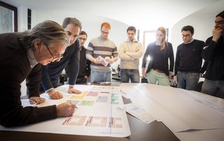 Architect Ricardo Bofill works on a project with his employees.