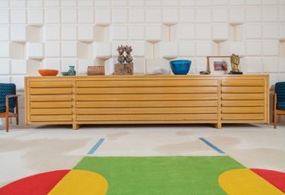 A Midcentury Time Capsule Captures an Architect's Love For Iconic Design - Photo 1 of 14 - Dow designed several pieces of furniture throughout his home. In the game room, he designed the long buffet table and had it manufactured by the furniture company Herman Miller. 