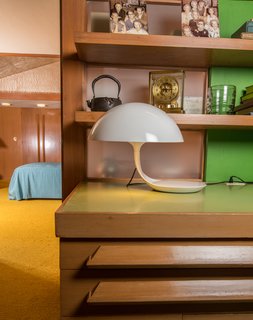 A Midcentury Time Capsule Captures an Architect's Love For Iconic Design - Photo 13 of 14 - Located in the sitting room, Elio Martinelli’s futuristic Cobra Lamp takes on the silhouette of a snake getting ready to strike.