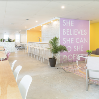 Members can perch at the bar, relax in a comfortable living area, or sprawl out at one of the many tables used for collaborative work.