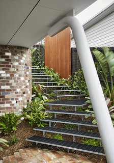 The architects were able to work with the property's steep topography by creating three distinct levels for the home.