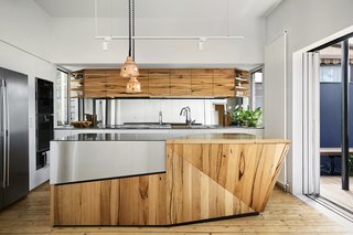 The kitchen cabinetry was fabricated using 100-year-old timber salvaged from Yarraville’s sugar mills. 