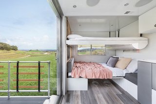 Simply pull down the top bunk from the ceiling and unfold the bottom bunk from the banquette. 