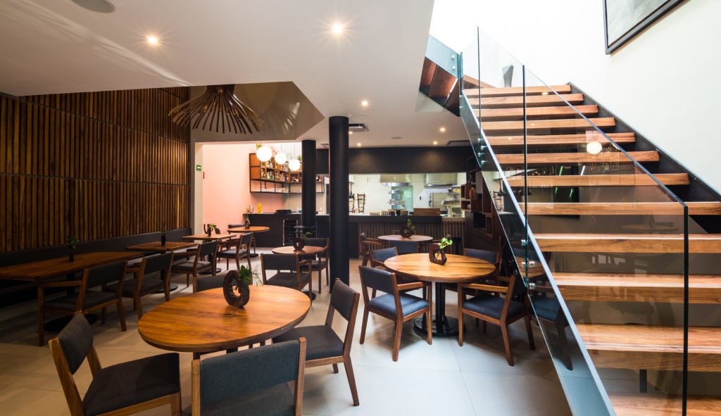 Handcrafted wood decor amid a neutral palette.