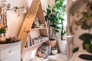 Zee and Gong made the triangle shelf for West Coast Craft; afterwards, it made its way Zee's kitchen as a display for books, souvenirs, and her ceramics collection.