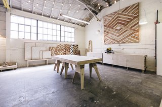A view of the workspace in Zee's studio with saw table on the right. 