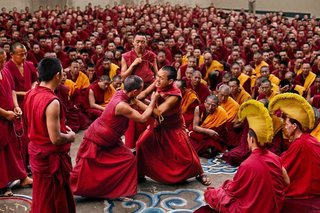 Tibetan monks debate at Sakya Monastery in Bylakuppe, India, 2001.