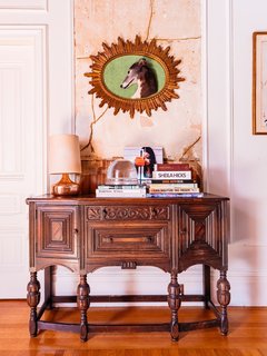 Windy's late dog, Thin Lizzie, is memorialized in her hallway over her grandmother's antique chest.
