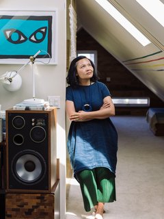 Windy Chien enjoys the sun-soaked attic. 