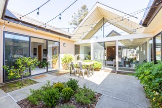 The atrium, one of the main distinguishing features of Eichler homes, connects the two A-frames.