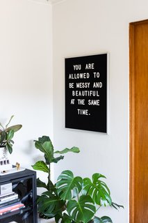 A positive affirmation hangs in Encarnacion's office. 