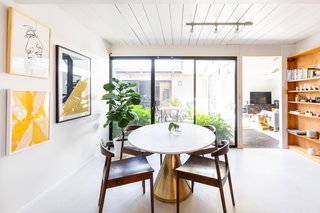 "A space in my house that I love is our bougie breakfast nook with the fancy marble table and brass pedestal bottom," says Encarnacion.