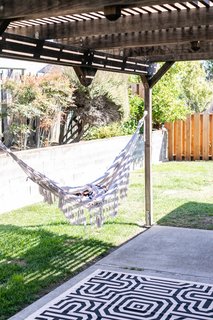 On warm days, Encarnacion can be found lounging in her hammock in the backyard. 