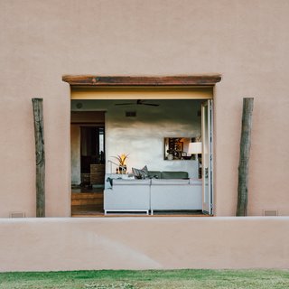 The 5,000-square-foot home has a main house with four bedrooms and three bathrooms, and a one-bed, one-bath casita. It’s the epitome of a Santa Fe-style hacienda with a single story, endless loggias, and desert panoramas visible from every room.