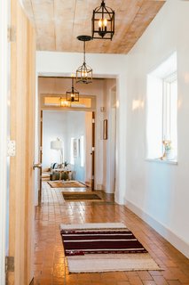 Young's obsession with textiles is apparent—vintage rugs are strewn throughout the home in an array of styles and hues.
