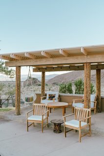 "The loggia poles around the hose at all patio areas were painted a dark green. We had them sanded to bring back their original rustic wood glory."