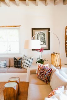An eclectic display of pillows showcases Young's affinity for textiles.