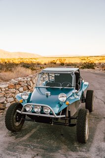 "The buggy is a 1972 VW Meyers Manx dune buggy. We bought it last year and had quite a bit of work done to it so it can handle the rugged desert terrain with ease. We added a new frame, new suspension, new tires, new wiring, and a roll cage. The engine and the body are the only original elements."