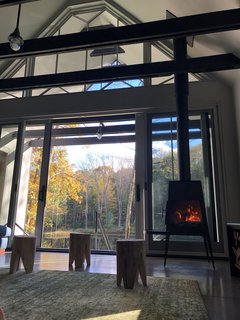 A glass wall opens up the indoor living area to the great outdoors. 