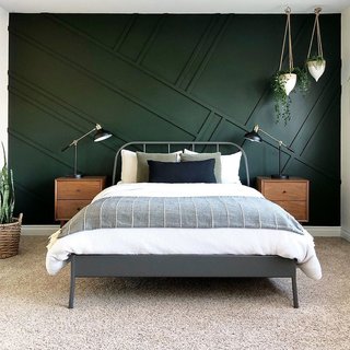 To create this accent wall, Rose measured and cut each piece of wood at 30 and 60 degree angles, nailed them into the wall, caulked, and spray painted. This cost her a total of $20. The bed frame, she snagged from Ikea (Kopardal). Bedding is Nate Berkus from Target, and the throw is Opalhouse from Target.