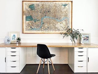 Rose placed a custom 10-foot-long wood top over IKEA Alex drawers to create an extra large desk with storage.