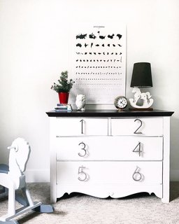 Conklin updated a dresser with house numbers for knobs. Her two-year-old helps put his clothes away by figuring out which number they go behind. 