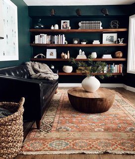 What began as a stark room with pale-yellow walls and beige carpet is now a plush reading area. 