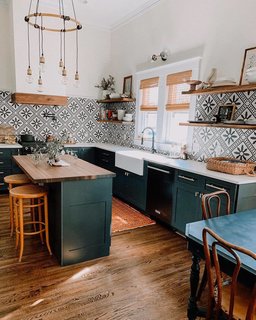 Sprinkle entirely redid the kitchen in the signature emerald that permeates the entire home.