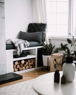 Lindi added some texture to the living room window nook with a lumbar pillow she sewed from a thrifted $4 shirt.